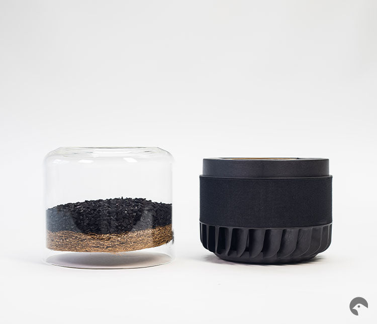Deconstructed Briiv purifier - on the left is the glass case, activated carbon filter and coconut filter. On the right is the mechanical portion of the filter.