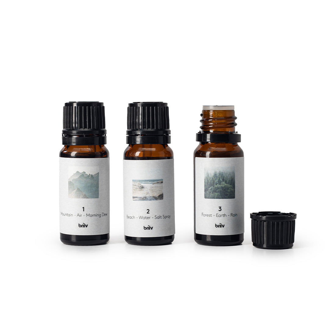 3 bottles of briiv fragrance with one open