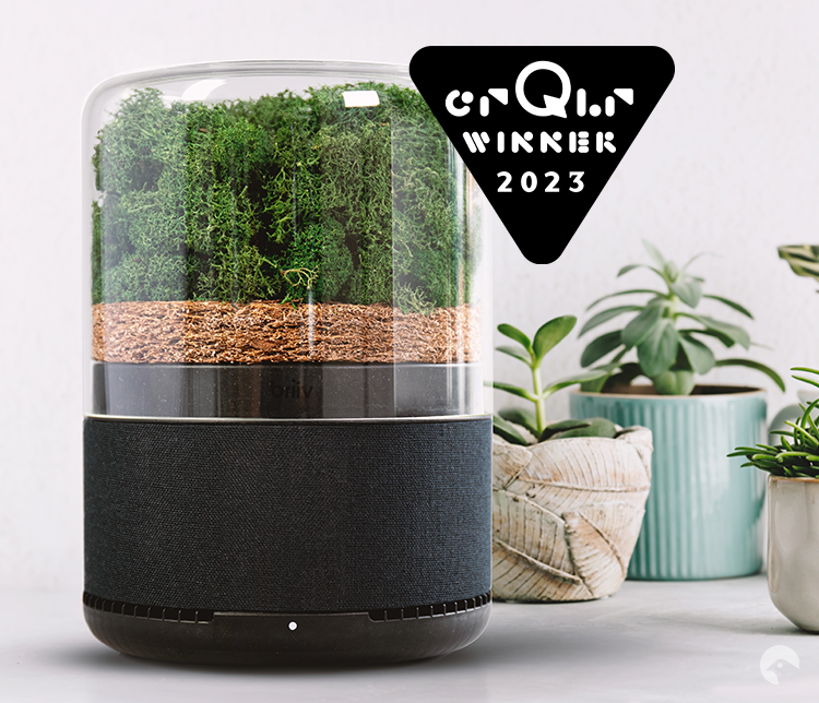 Briiv air purifier next to three plants and the crQlr award winner 2023 logo